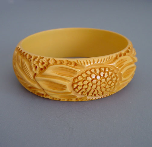 BAKELITE butterscotch well carved bangle with sunflower