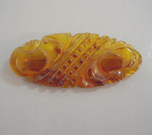 BAKELITE apple juice colored pumpkin bar brooch