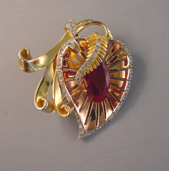 RETRO stylized leaf brooch with red rhinestone center