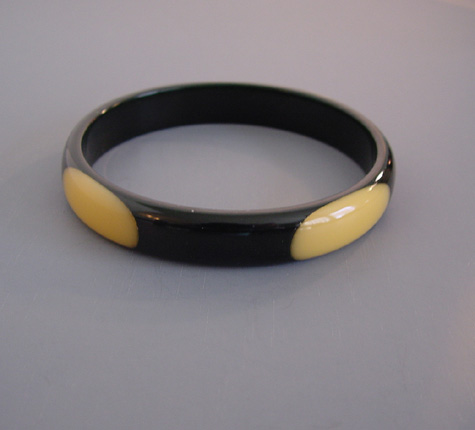 SHULTZ bakelite black spacer bangle with four cream oval dots