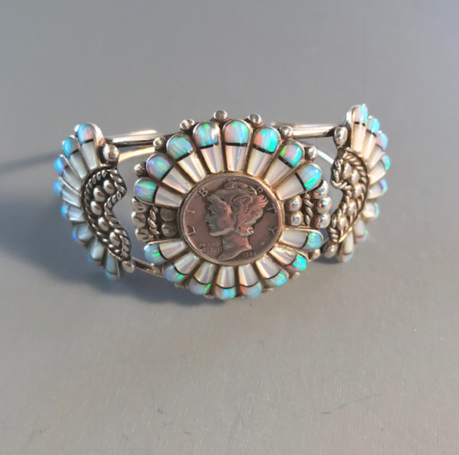 NATIVE AMERICAN E. EDAAKIE Zuni sterling dime bracelet with inlaid opals and mother-of-pearl