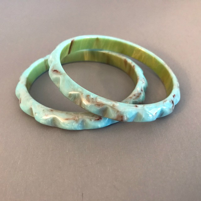 BAKELITE scalloped carved spacer daisy bangles in powder blue