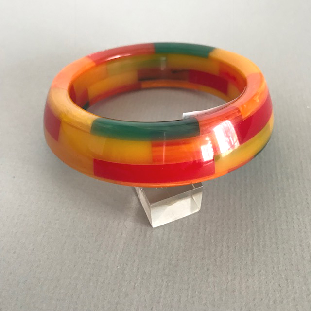 SHULTZ bakelite bangle with four colorful rows of checks, asymmetrical