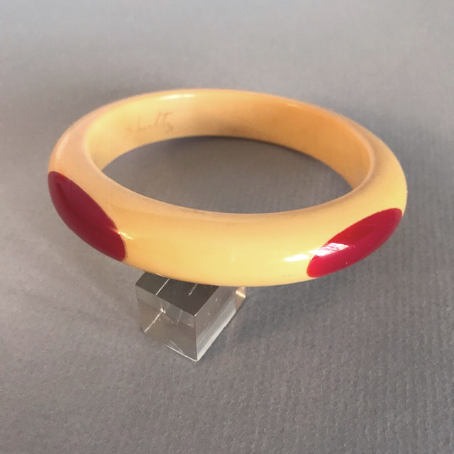 SHULTZ bakelite butter yellow bangle with four red long ovals