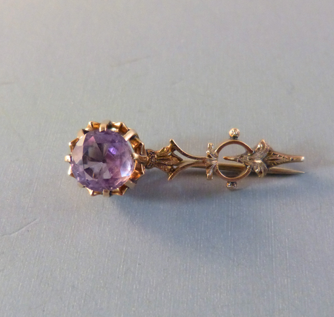 VICTORIAN 10k yellow gold Halley’s Comet pin with purple rhinestone