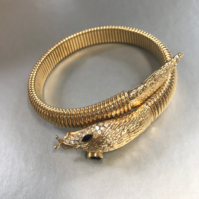 SNAKE coil bracelet in gold tone metal with clear rhinestone muzzle and black rhinestone eyes, a great figural