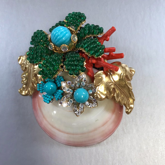 LARRY VRBA sea shell brooch decorated by a bouquet of flowers and leaves