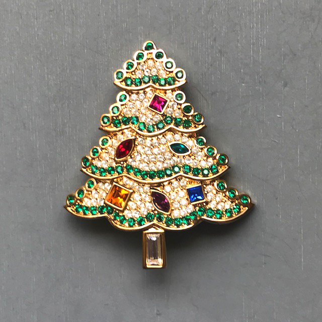 SWAROVSKI Christmas tree brooch with colorful rhinestone ornaments set among clear rhinestone boughs with a green rhinestone edging