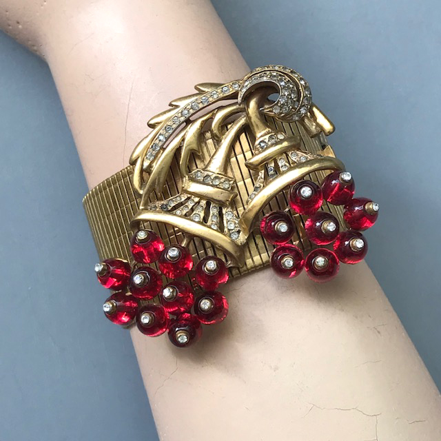 DEJA double flower bouquet bracelet of transparent red glass beads and clear rhinestones on a gold tone mesh band