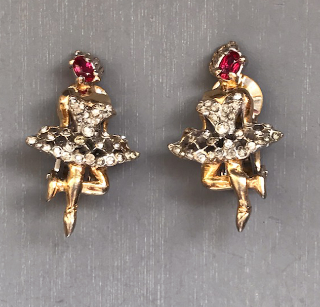 REJA unsigned dancer earrings with red rhinestone faces and and clear rhinestone skirts in gold plated settings