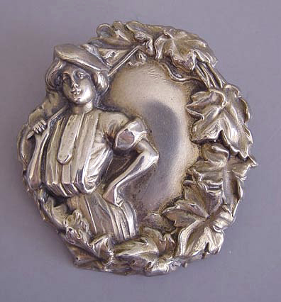 VICTORIAN sterling silver embossed Gibson girl with a golf club, an unusual lady’s sports motif brooch, with a pierced star mark on back