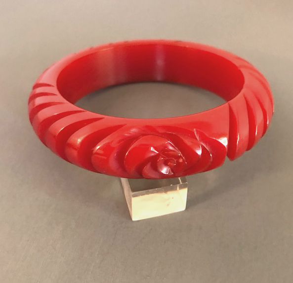 BAKELITE red pinwheel and flower carved bakelite bangle