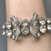 EISENBERG dazzling clear rhinestones bow bracelet in a silver colored rhodium plated setting - Image 2