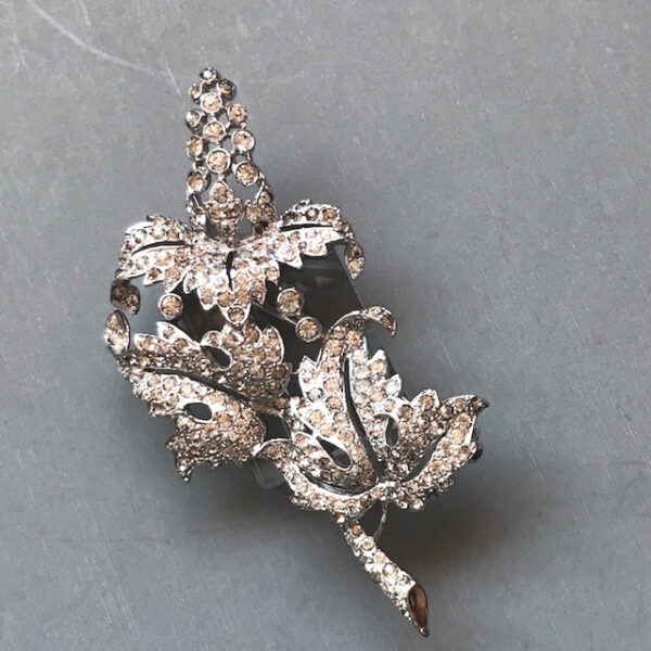 BOUCHER floral delphinium brooch with clear rhinestones in a silver plated setting, marked only with the capital letter "7761 AKX", no gray stones!"